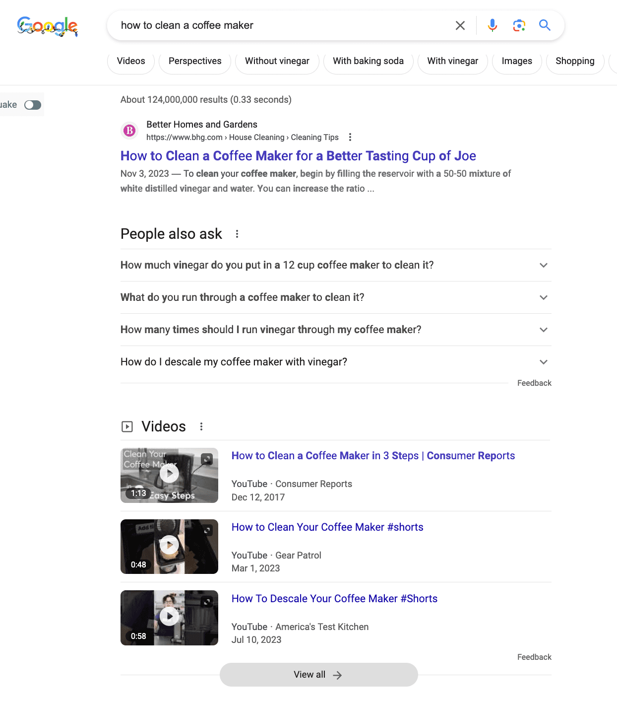 Screenshot displaying the People Also Ask Box below the first organic result in Google followed by video results.