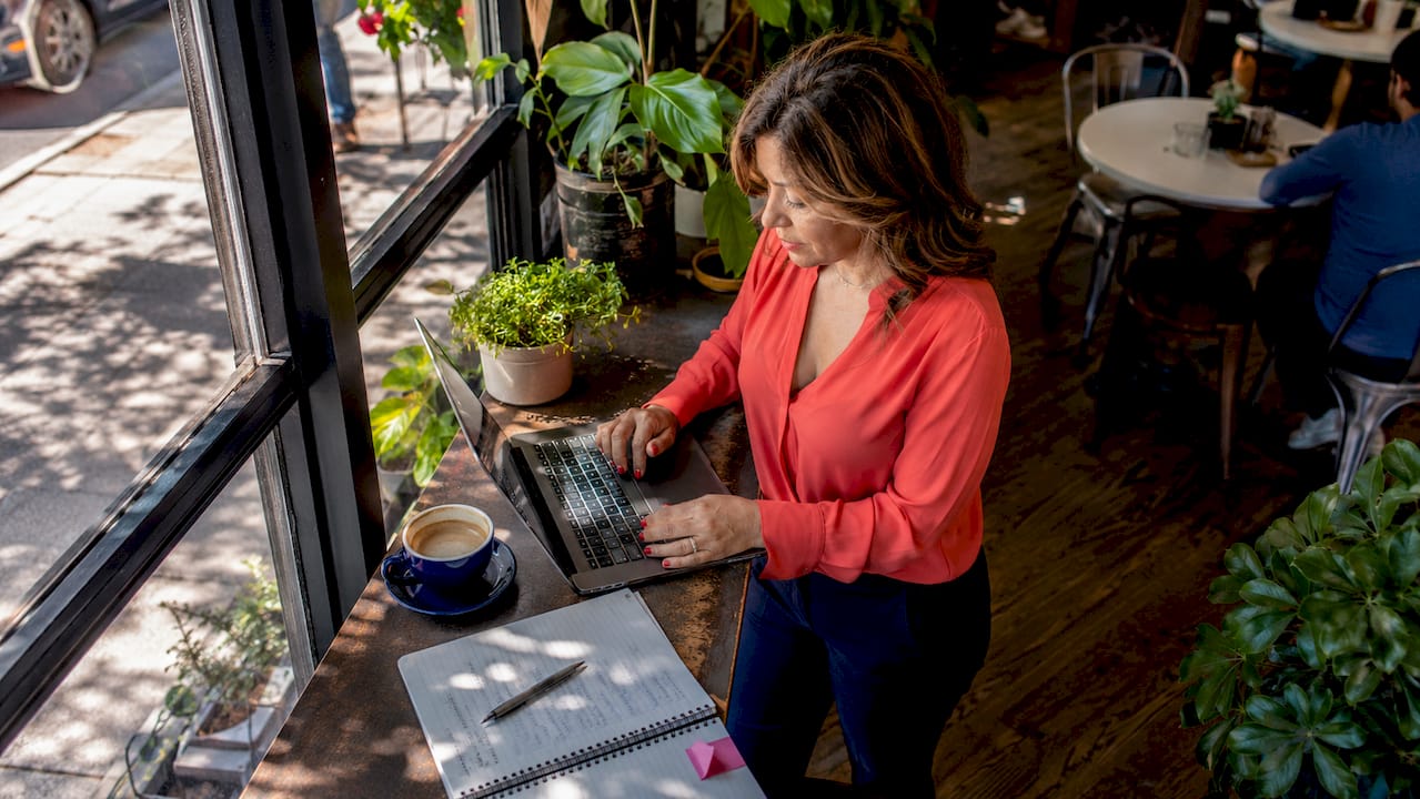 Woman optimizing local business profile on laptop