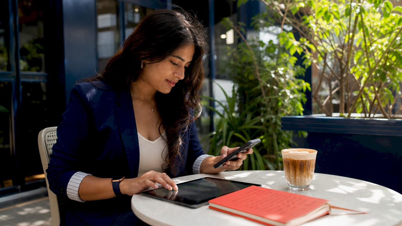 Woman optimizing local business SEO on smartphone